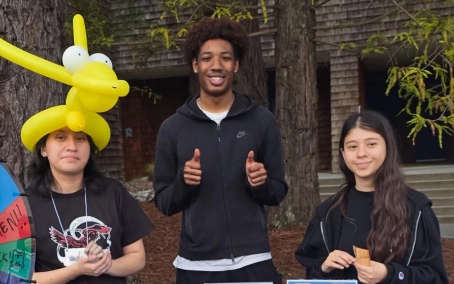 College Nine Senate members tabling outside the residence halls with a prize wheel