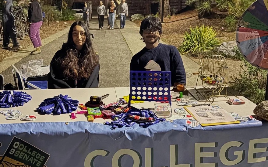 The College Nine Senate table at a night event, with games and giveaways