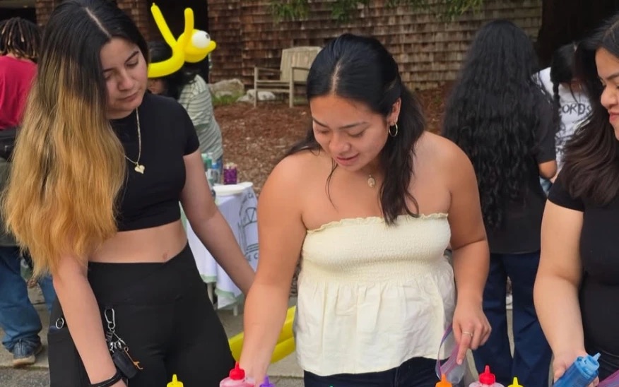 Students tie-dyeing shirts at a Senate-funded College Nine event
